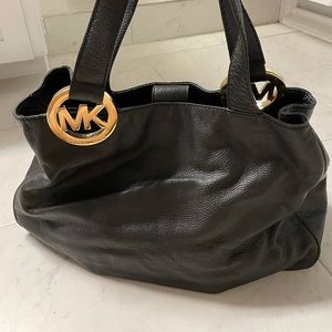 Black leather Michael Kors shoulder bag.